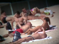 Candid beach camera is capturing hot tanned boobies