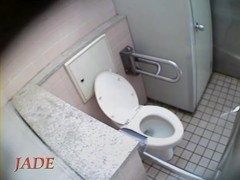 Hidden camera in toilet shoots girl masturbating cunt