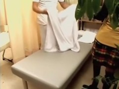 Busty Jap gets a dildo up her twat during medical exam