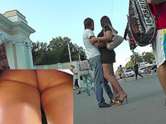 Evening upskirt view in a public place with chick