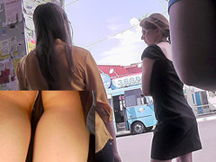 Evening upskirt view in a public place with chick