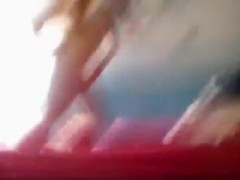 Russian guy has missionary sex with condom with his gf on the bed, while a friend tapes the action.
