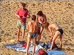 Nudist family leaving the beach