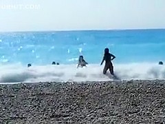 Accidental nudity shown in wavy water