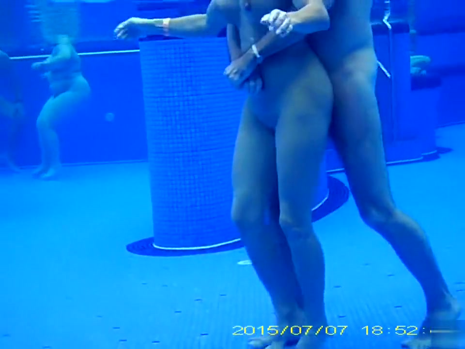 Underwater sex in the pool at the nudist resort