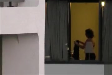 Imposing neighbor changes her clothes