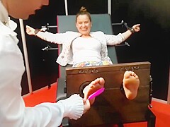 Mainstream woman feet tickling in stocks