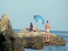 Kinky couple having naughty fun on a nice secluded beach